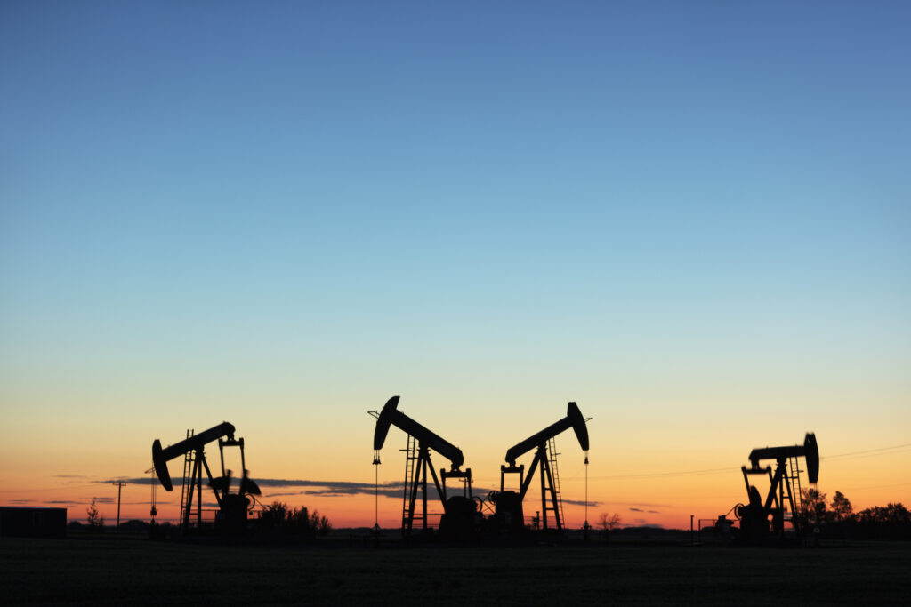 Four pump jacks producing oil, Image taken near the town of Virden, Manitoba. Image taken from a tripod.