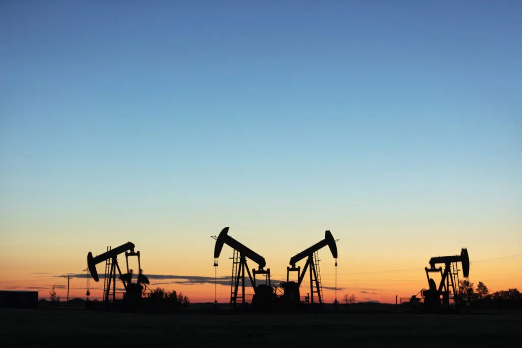 Four pump jacks producing oil, Image taken near the town of Virden, Manitoba. Image taken from a tripod.
