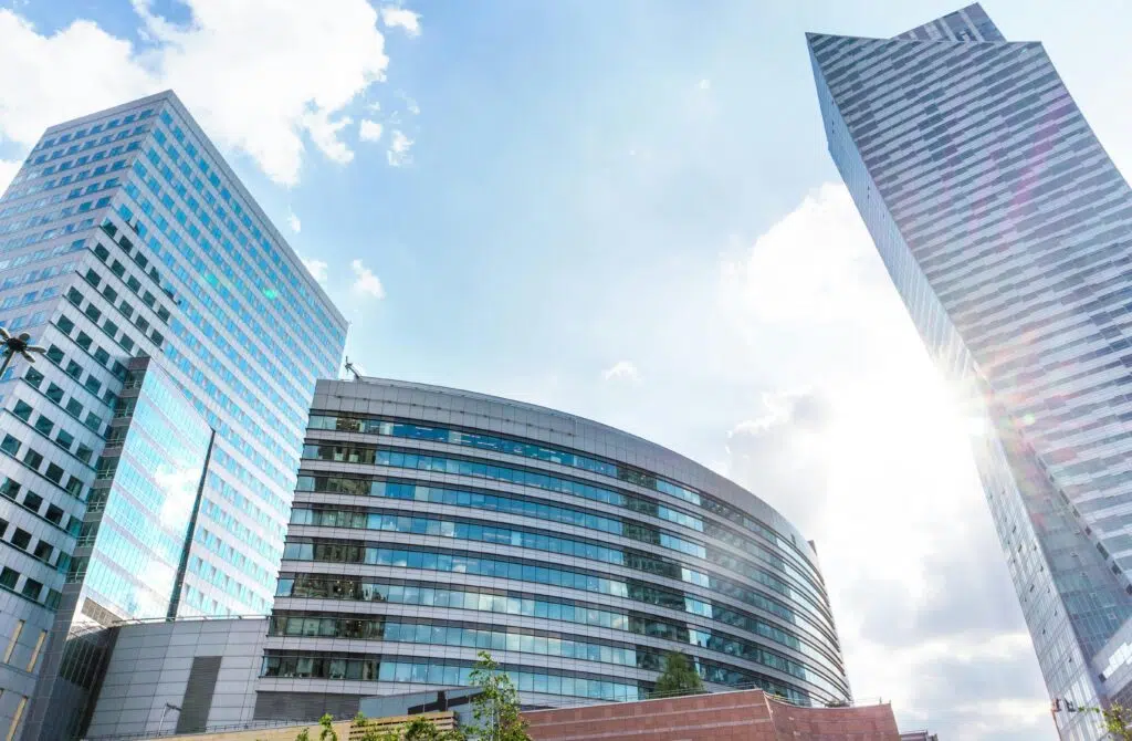 A shot of three buildings in bright sunlight