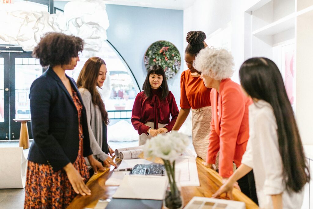 5 women looking at products