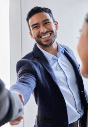 Shot of two businesspeople shaking hands during a meeting