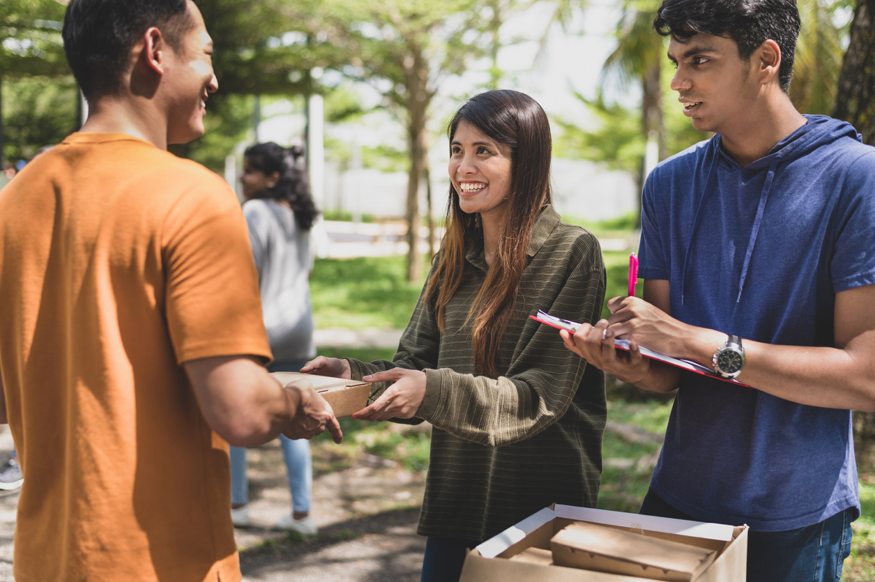 Students talking to a representative on campus
