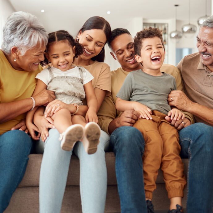 Happy, big family and quality time bonding of children, parents and grandparents together on a sofa. Laughing kids having fun with mom, dad and grandparent on a home living room couch with happiness Happy, big family and quality time bonding of children, parents and grandparents together on a sofa. Laughing kids having fun with mom, dad and grandparent on a home living room couch with happiness