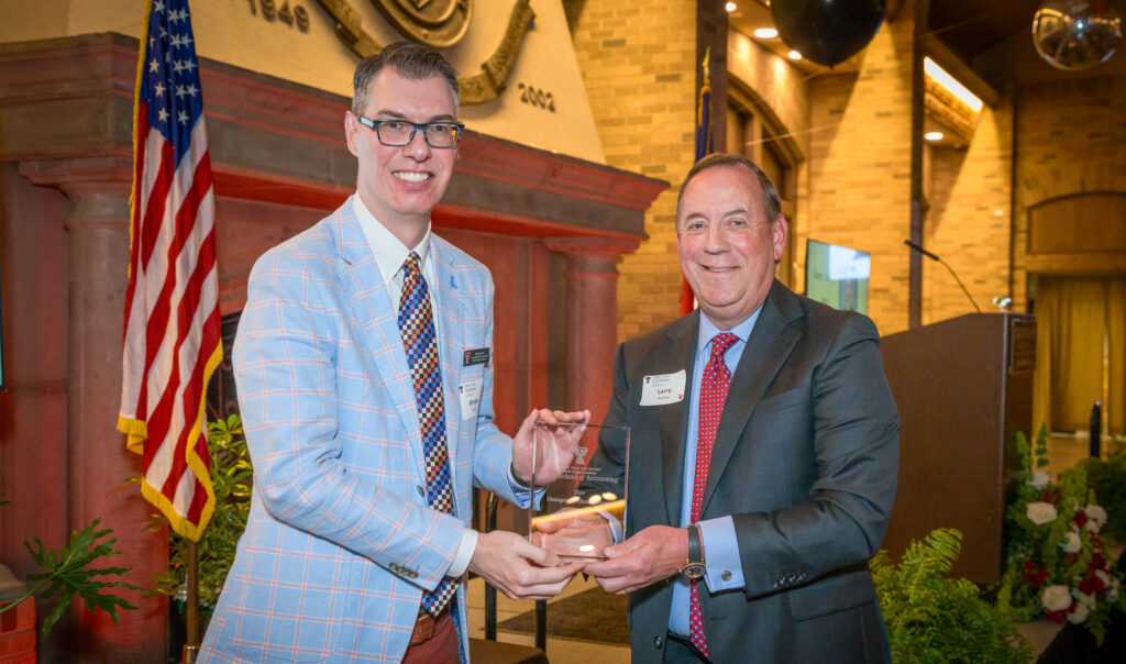 Chairman Larry Autrey receiving award from Texas Tech