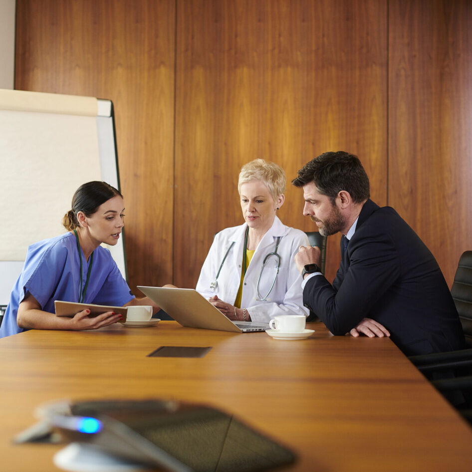 business medical meeting female doctor and nurse meet with administrator